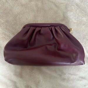 Wine colored clutch with interchanged straps